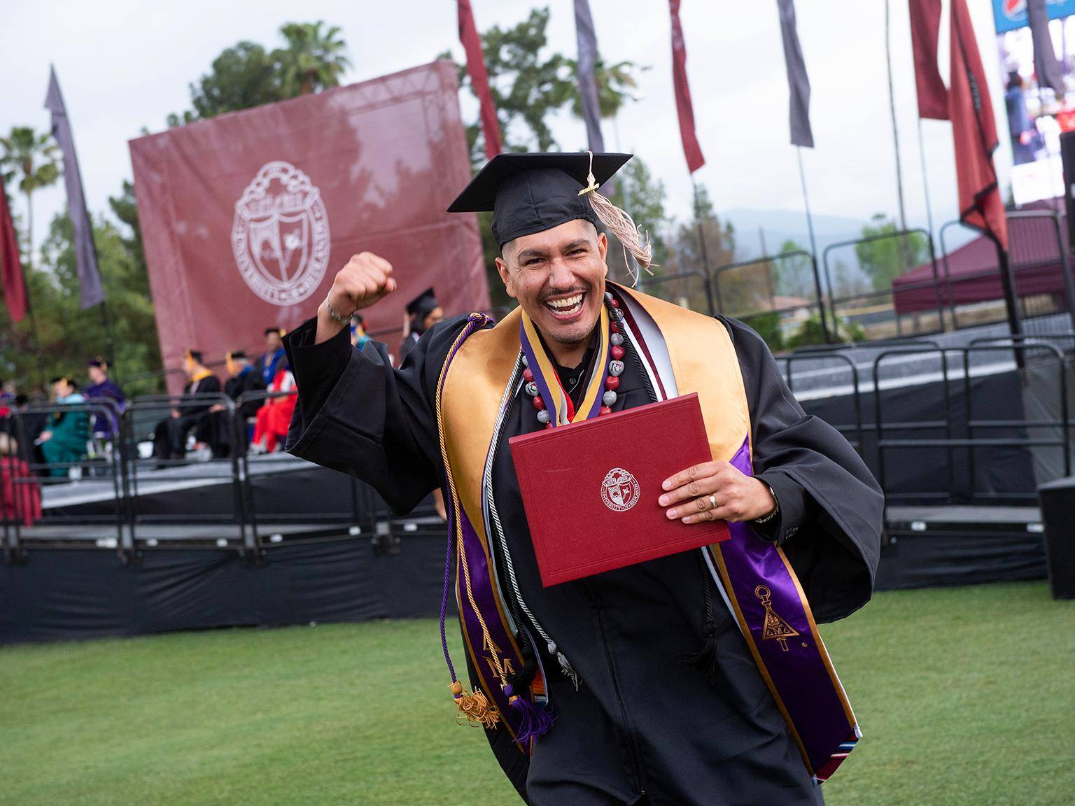Image card - School of Business graduate student at graduation