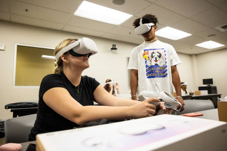 a woman wearing virtual reality goggles