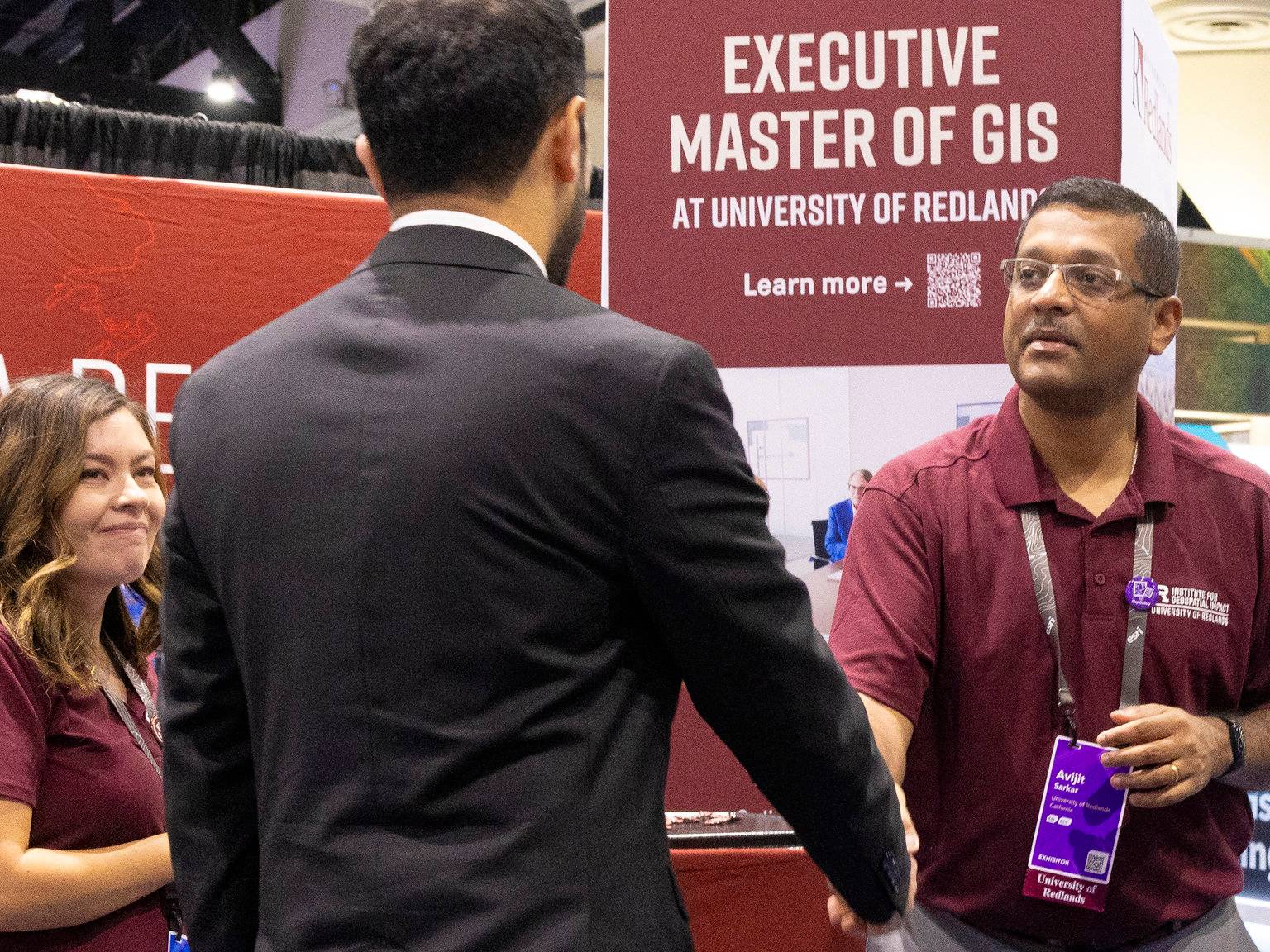 a man shaking hands with another man