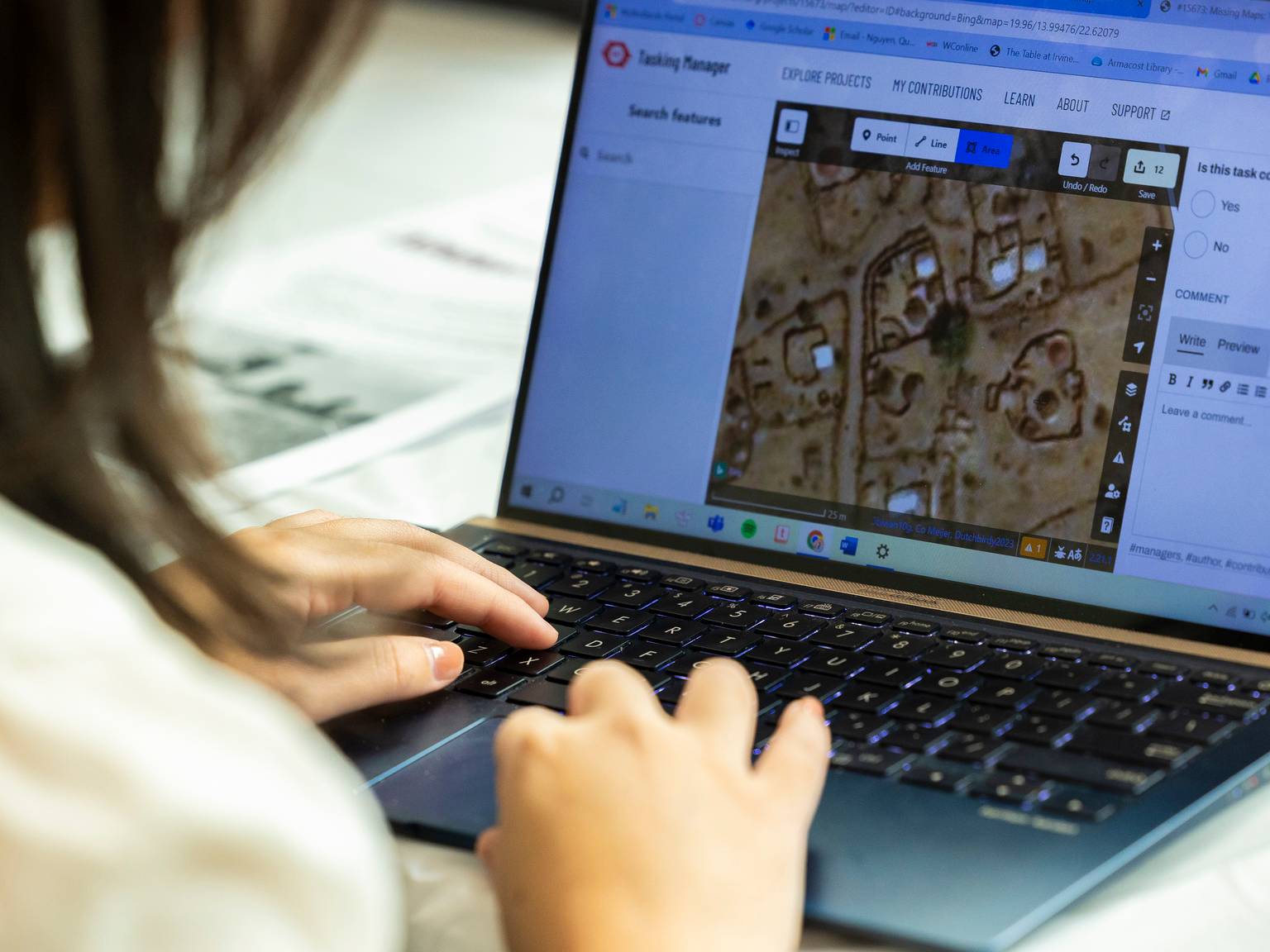 a person typing on a laptop