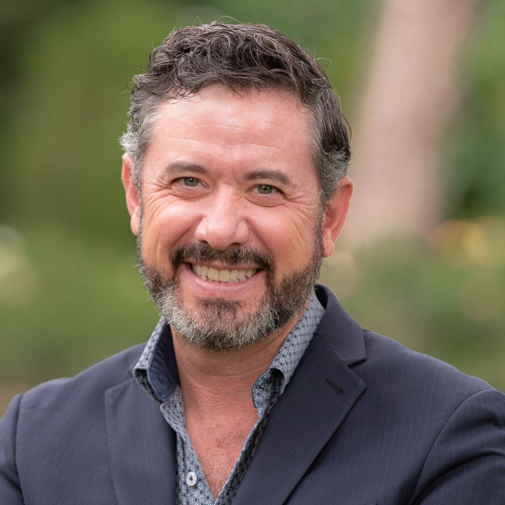 a man smiling for the camera