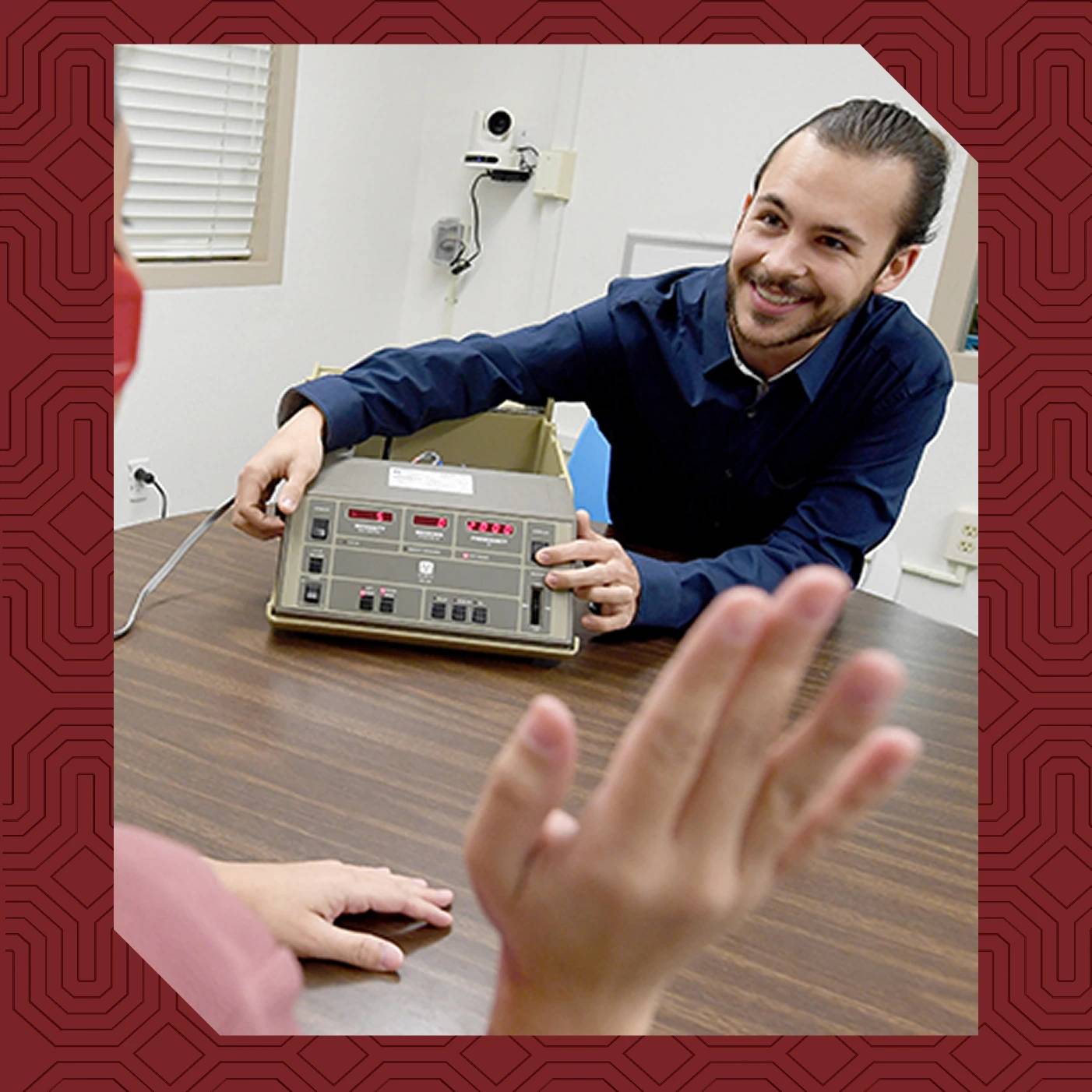 a man smiling at a machine