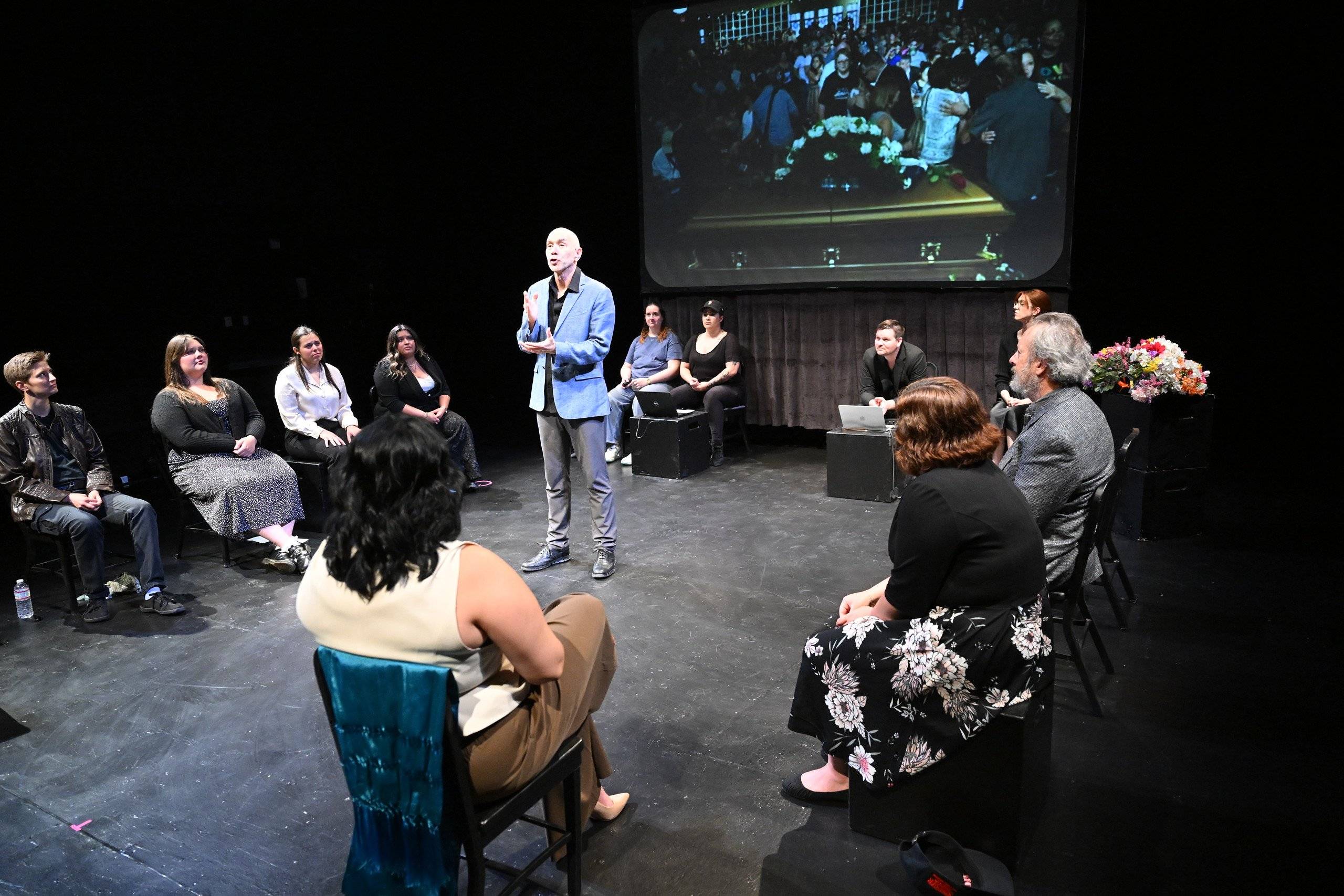 a man standing in front of a group of people