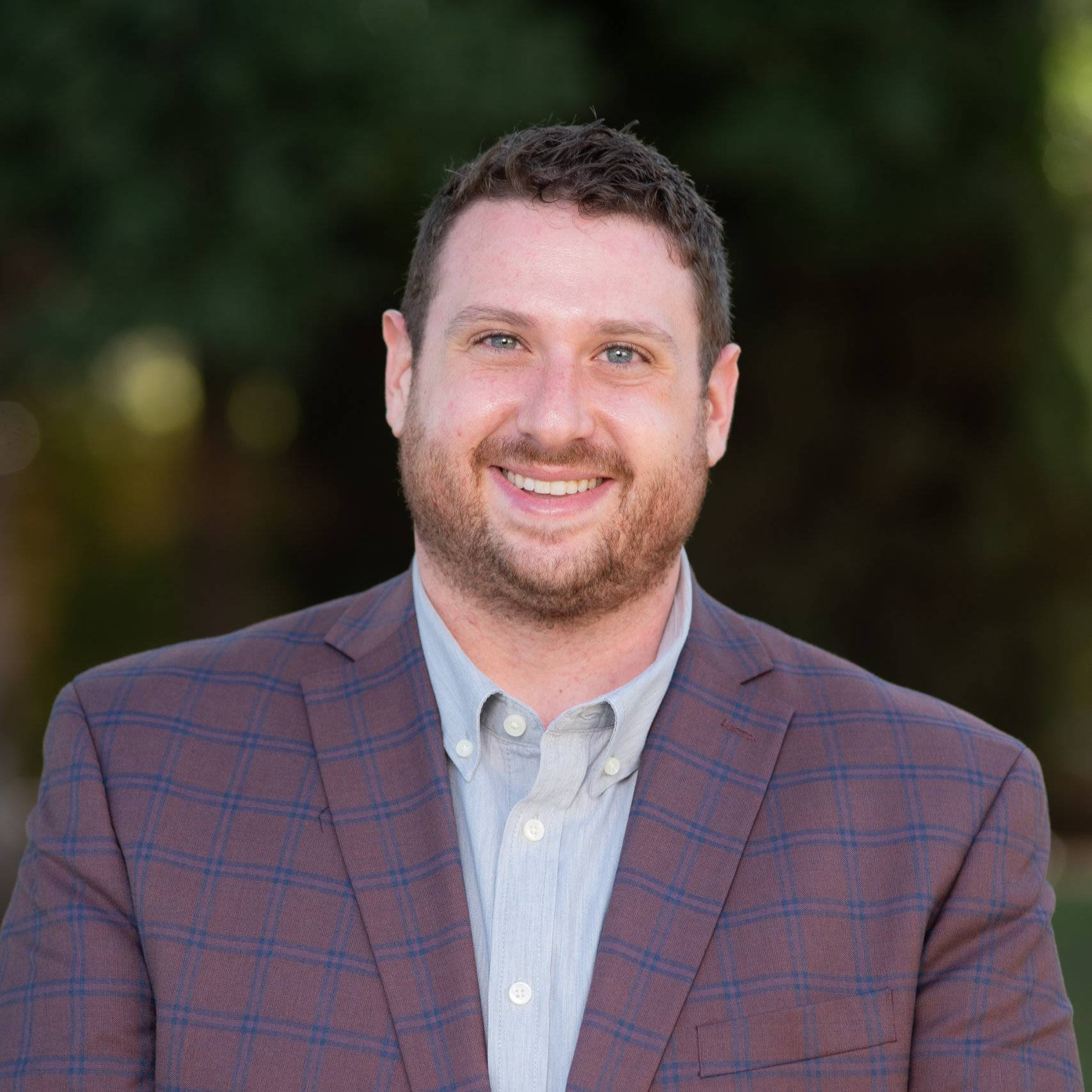 a man smiling for a picture