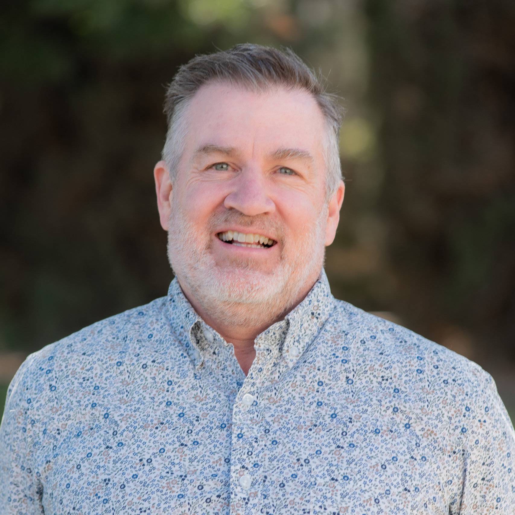a man smiling for a picture