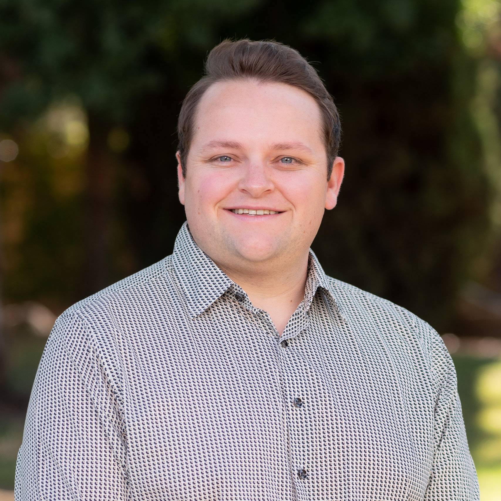 a man smiling for a picture