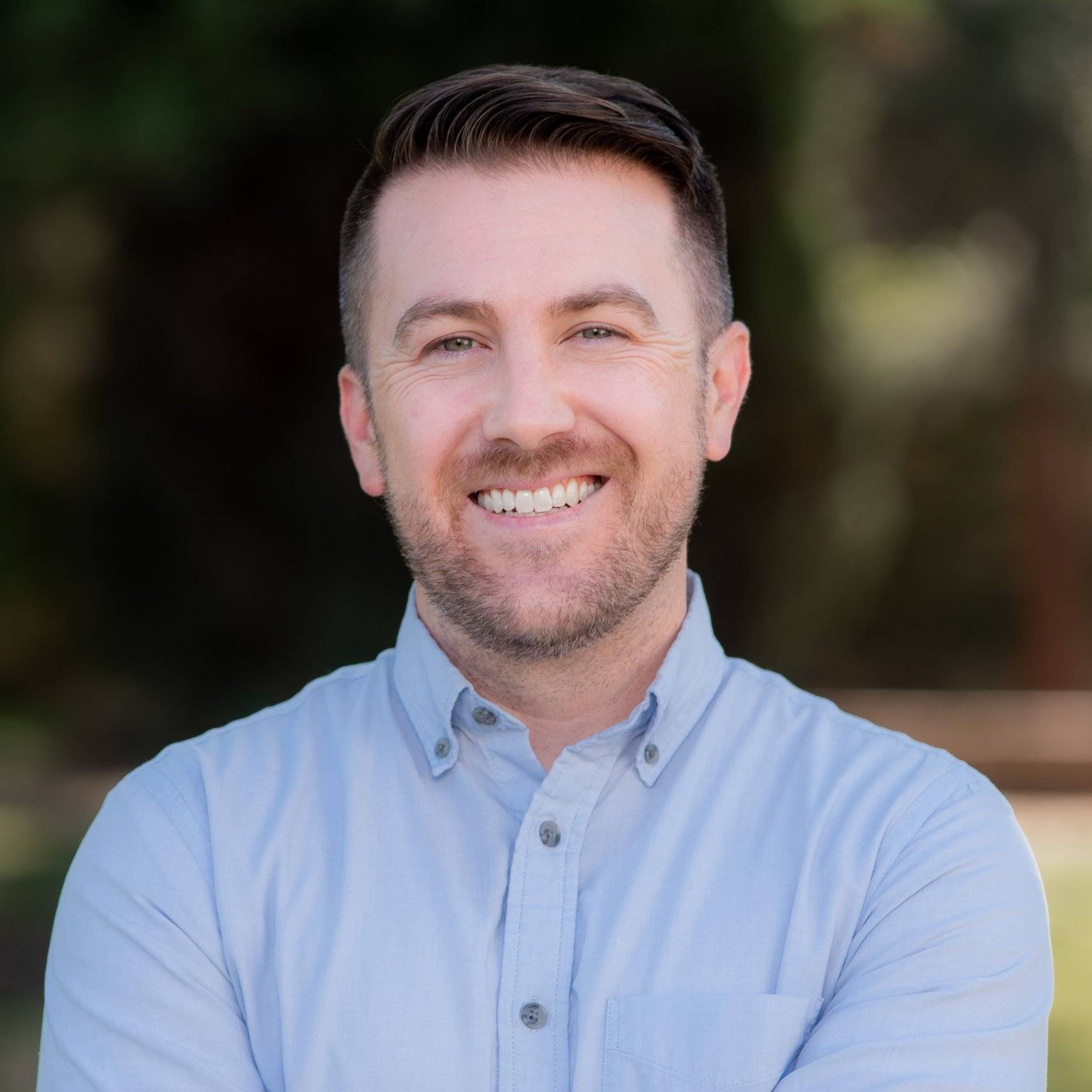 a man smiling at camera