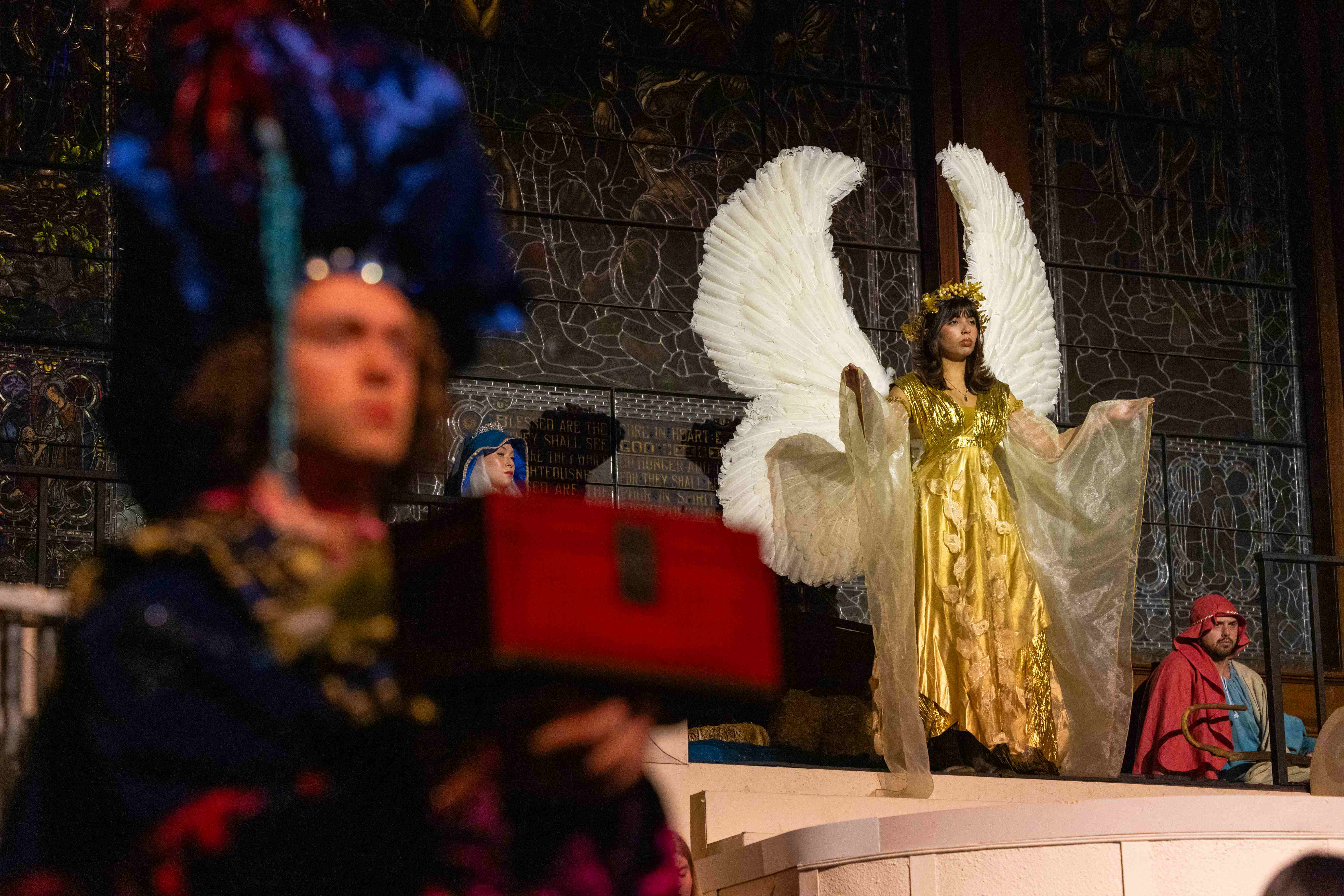 a woman wearing angel wings and a crown