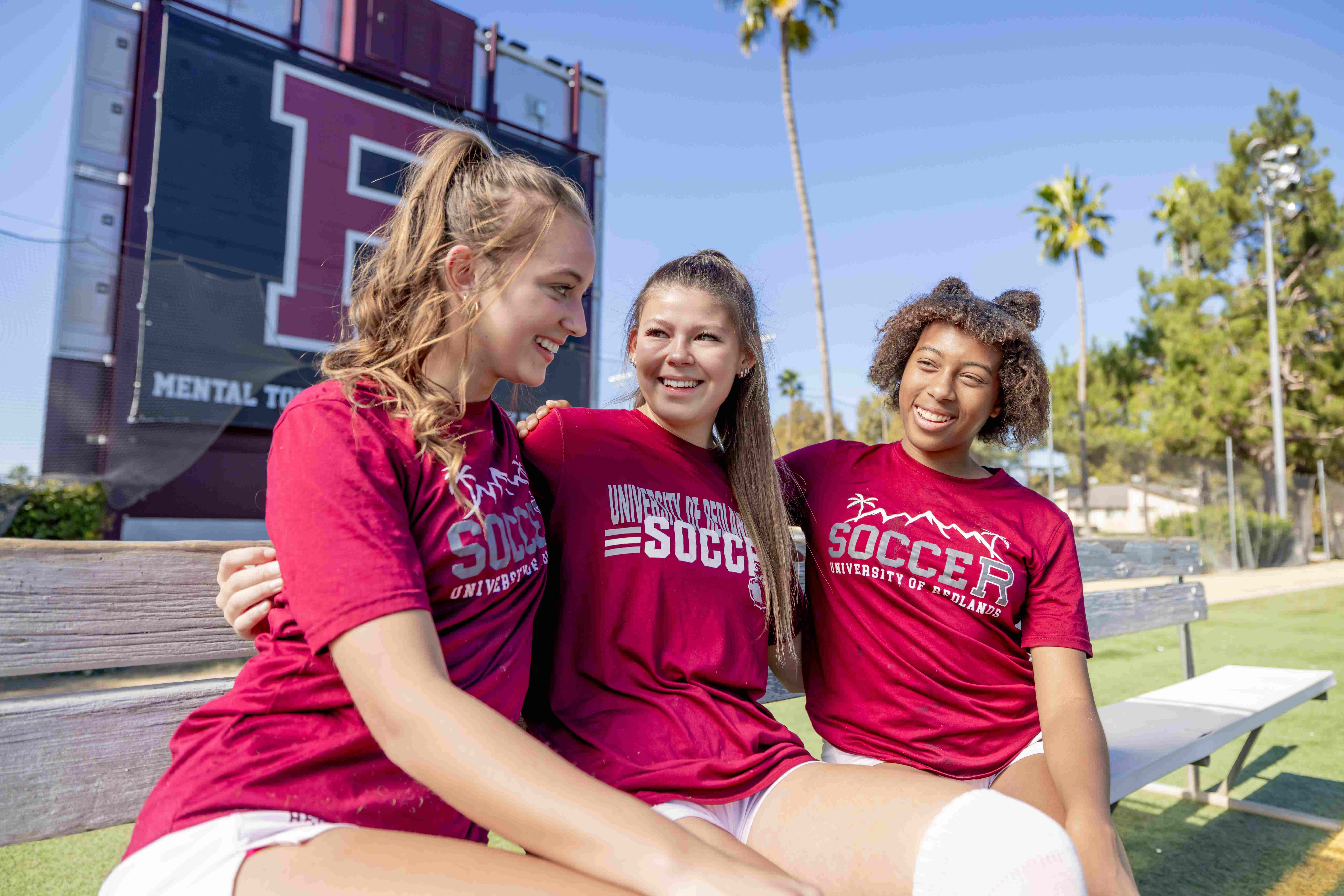 a group of girls wearing matching shirts