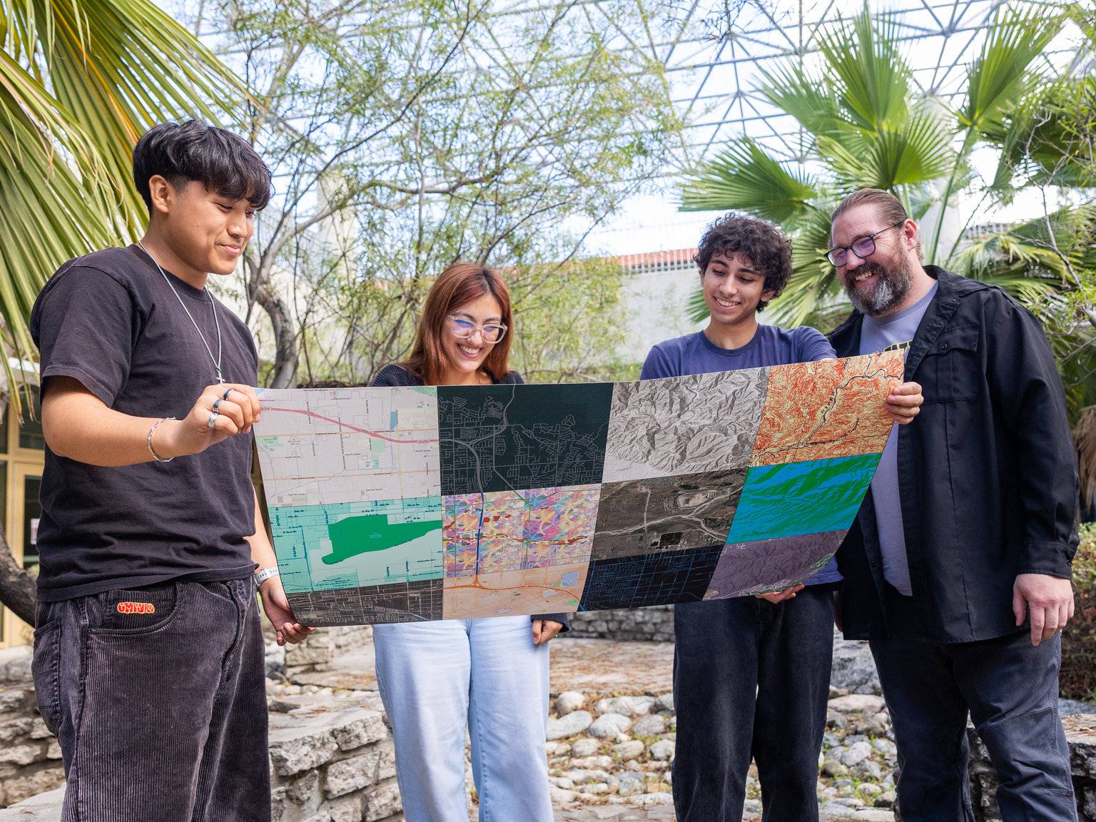 a group of people holding a map