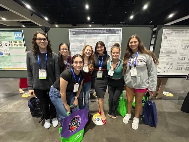 a group of women posing for a photo