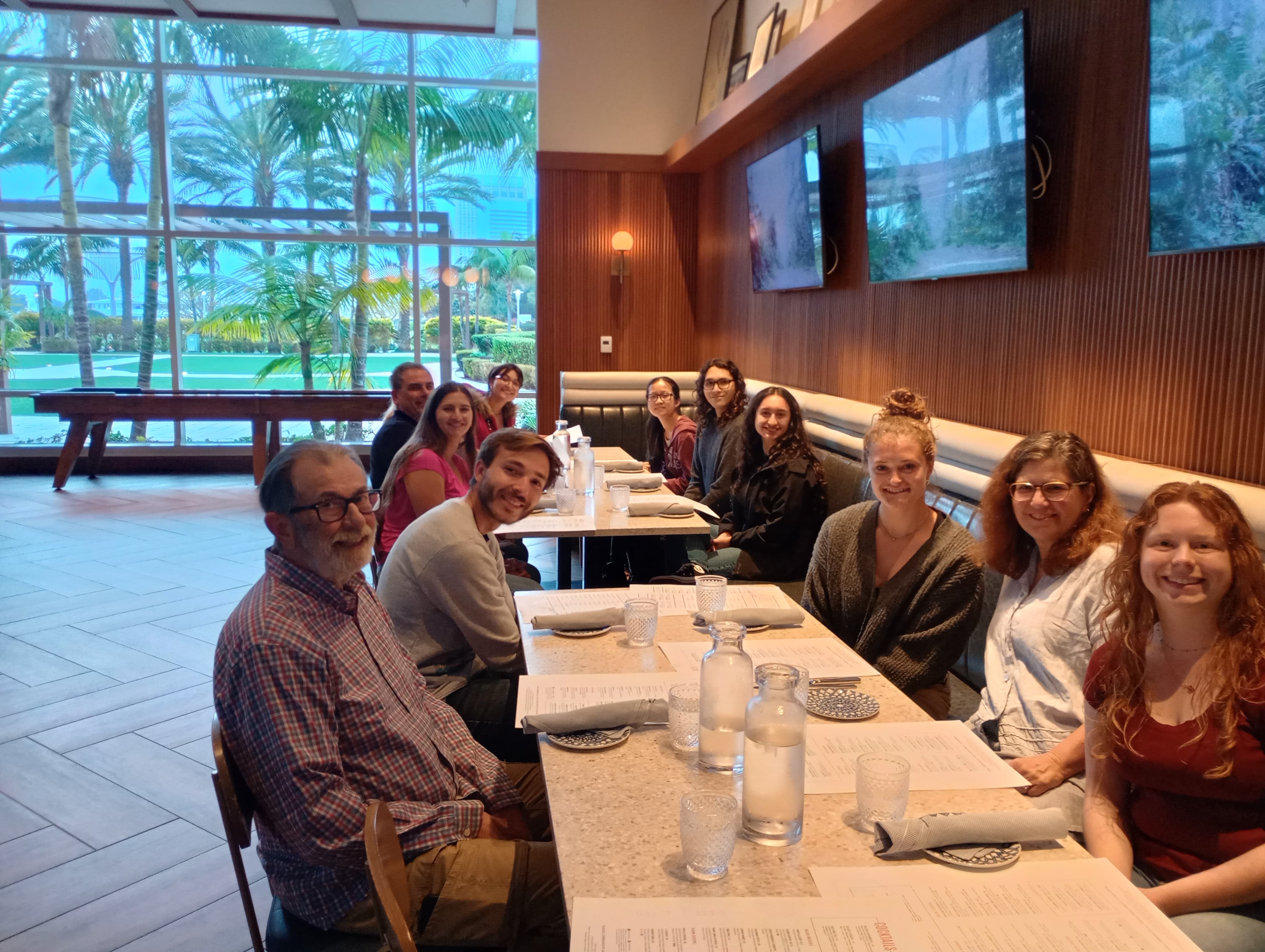 a group of people sitting at a table