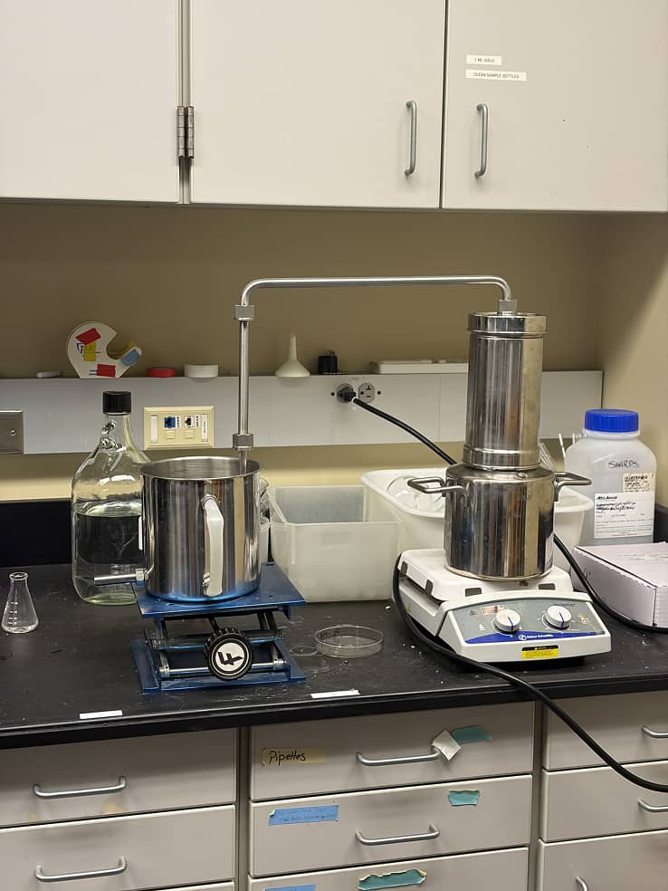 a laboratory with a machine and a container