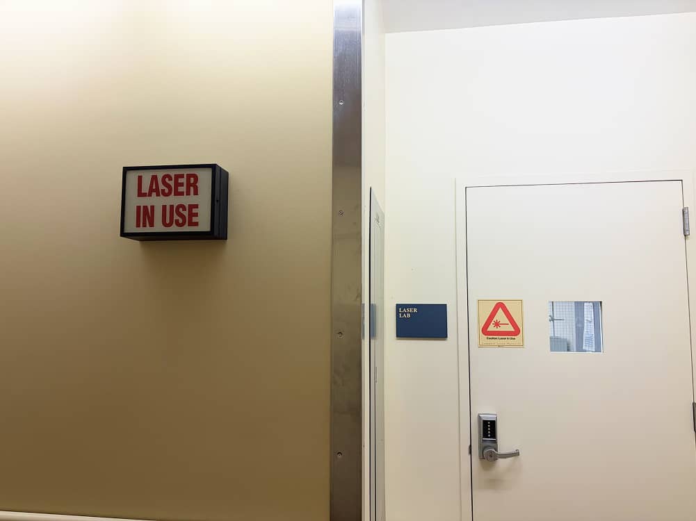 a white door with a red sign on it