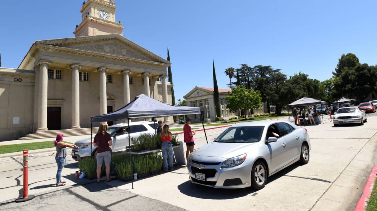 a group of people standing outside a building