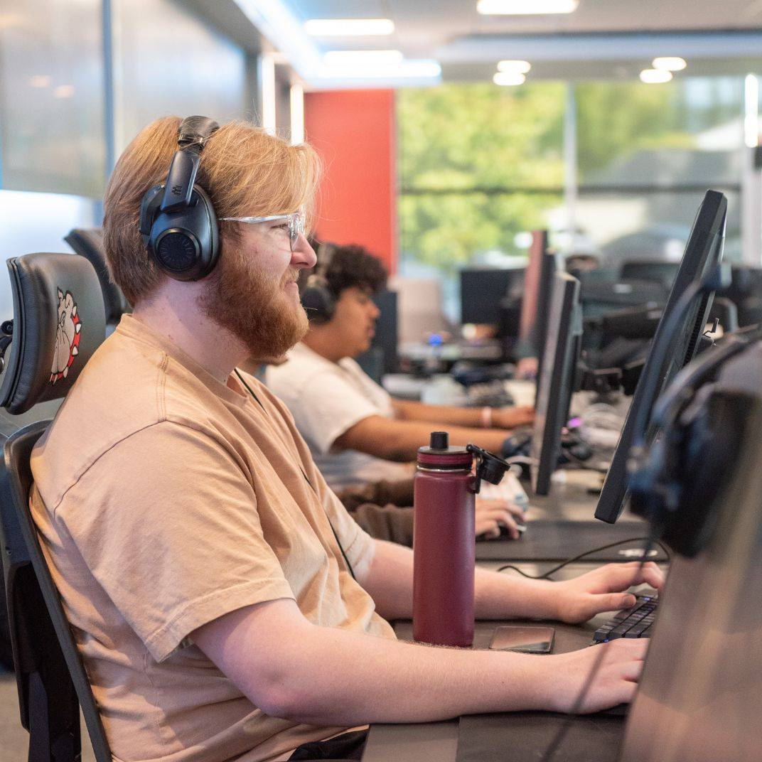 a group of people sitting at computers