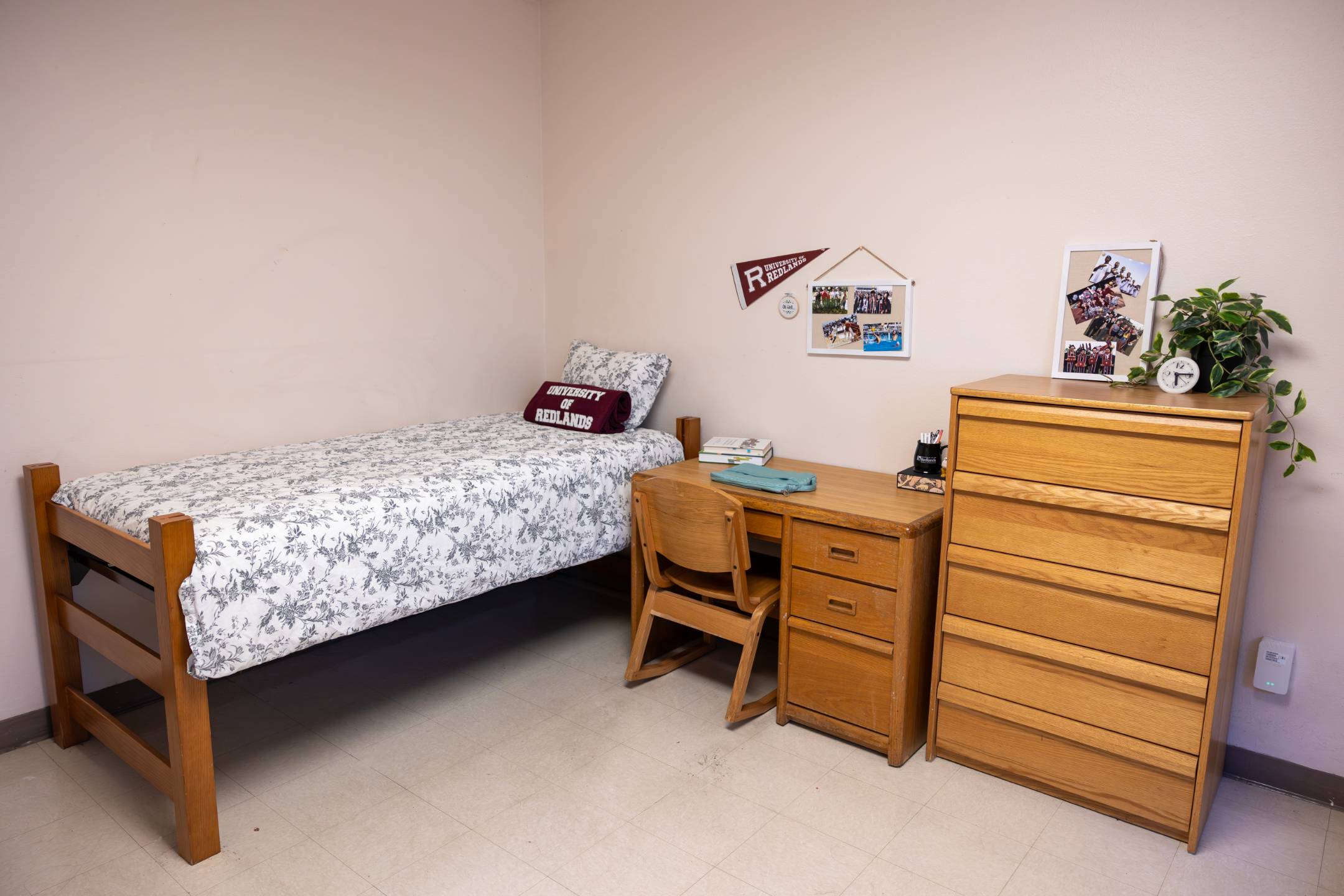a bedroom with a bed and desk
