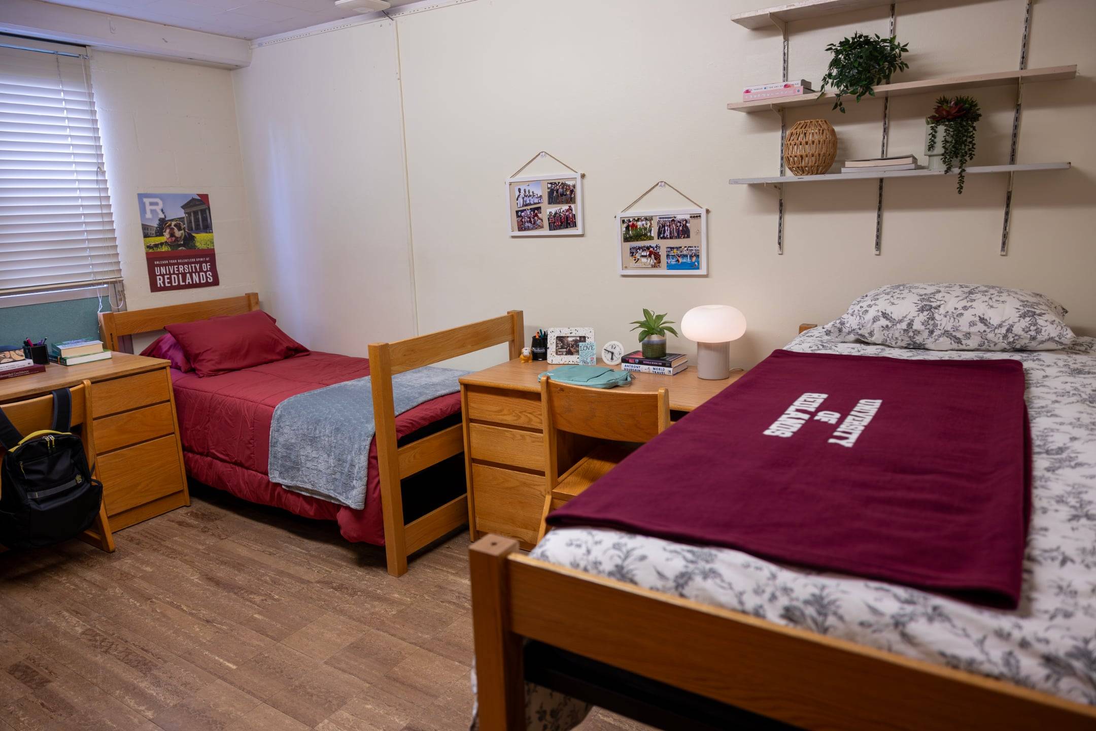 a room with two beds and a desk