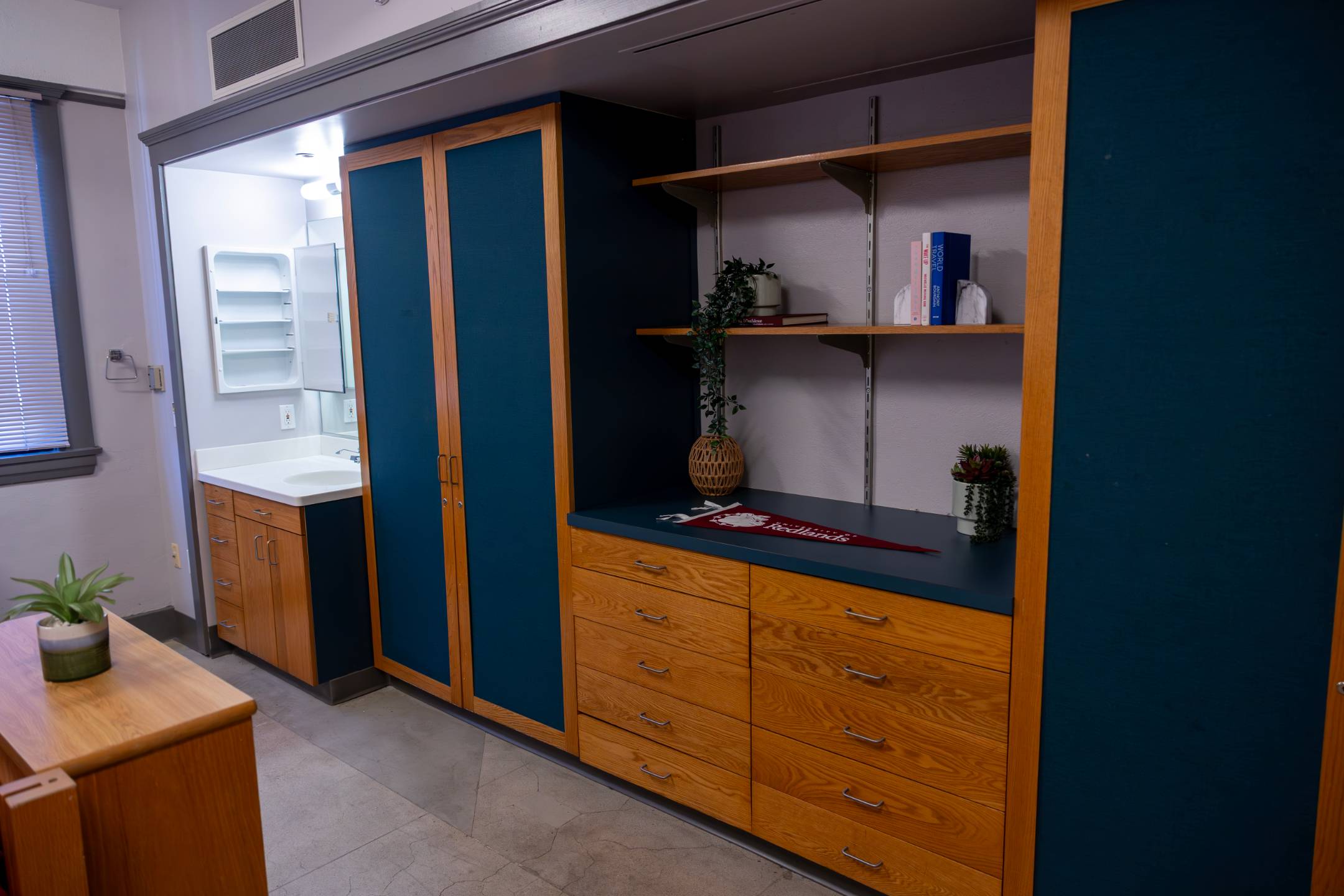 a room with blue cabinets and shelves