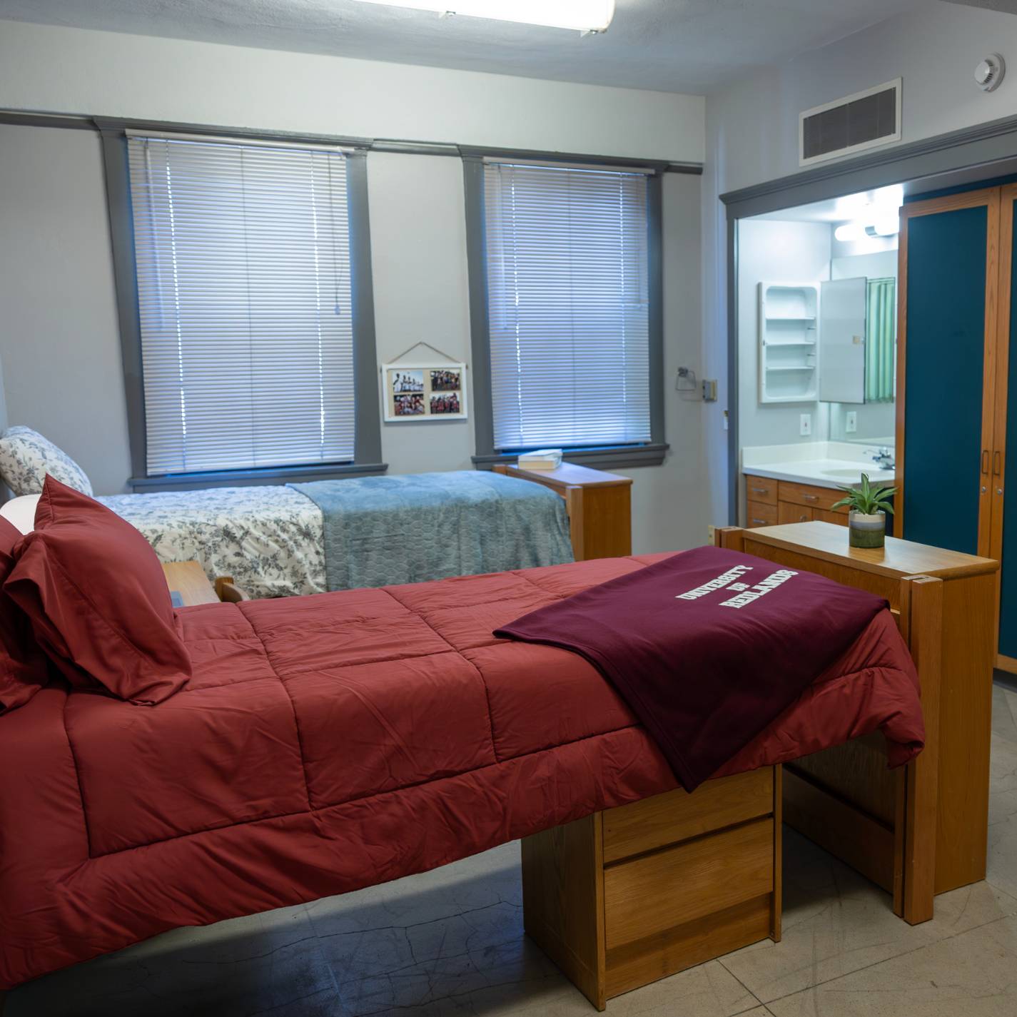 a room with two beds and a mirror