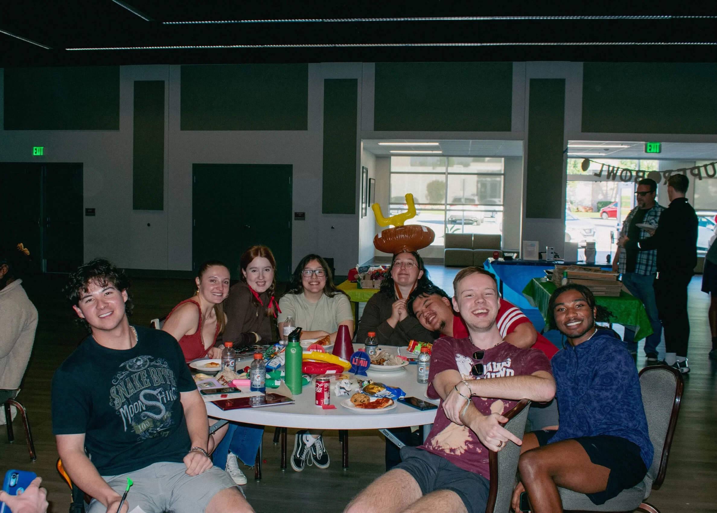 a group of people sitting around a table