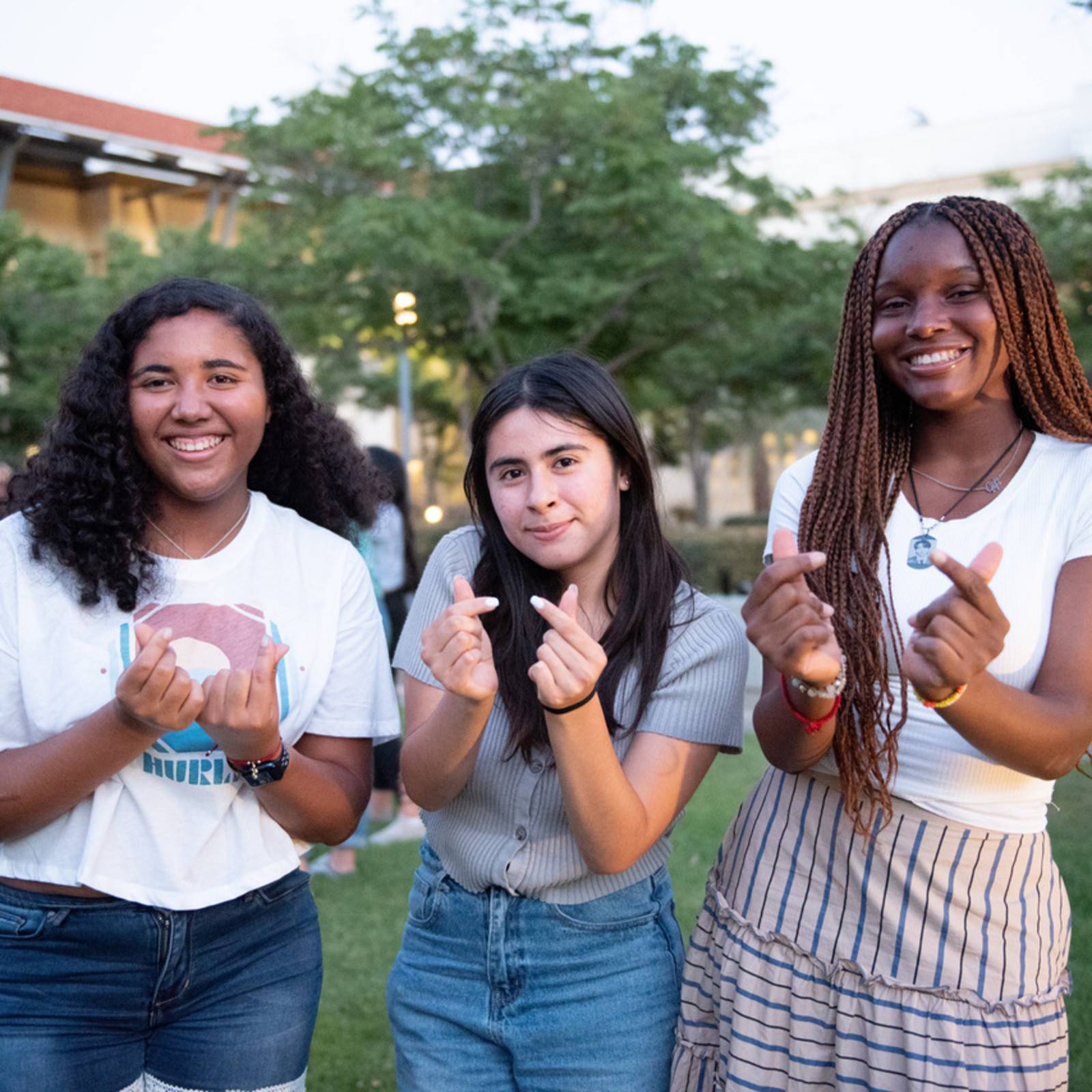 a group of girls standing in a field