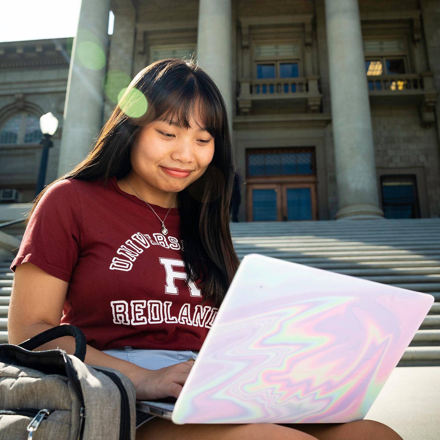 Mutiple media - Redlands student on laptop