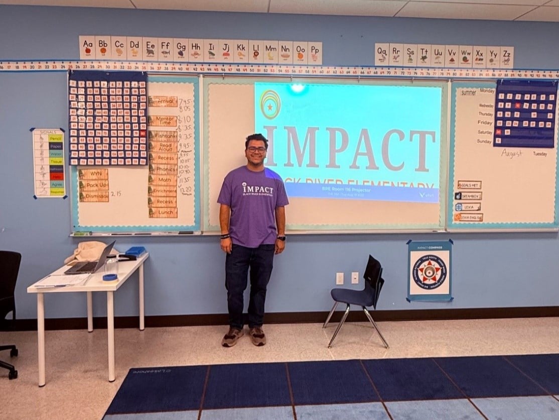 a man standing in front of a whiteboard