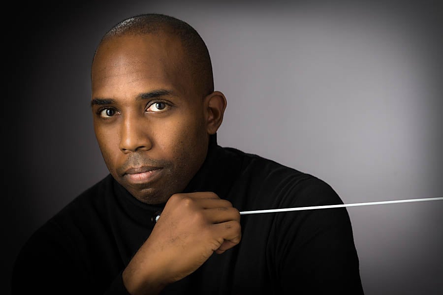 a man holding a stick