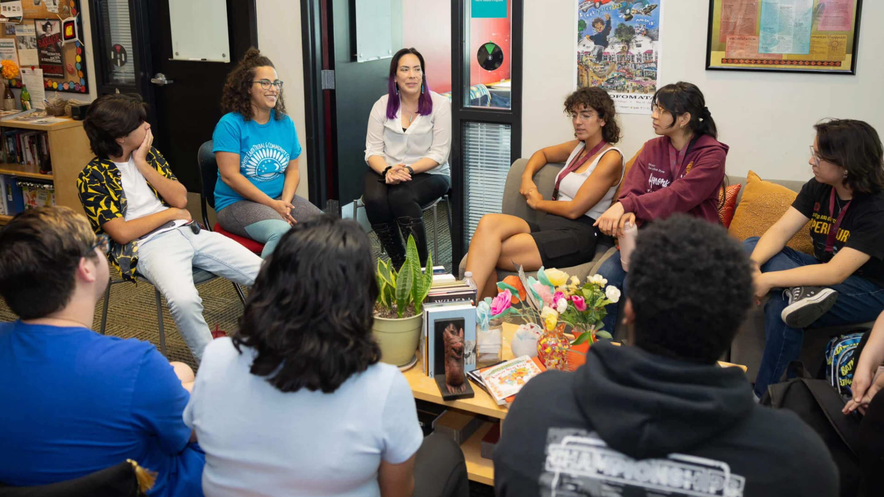 a group of people sitting in a circle