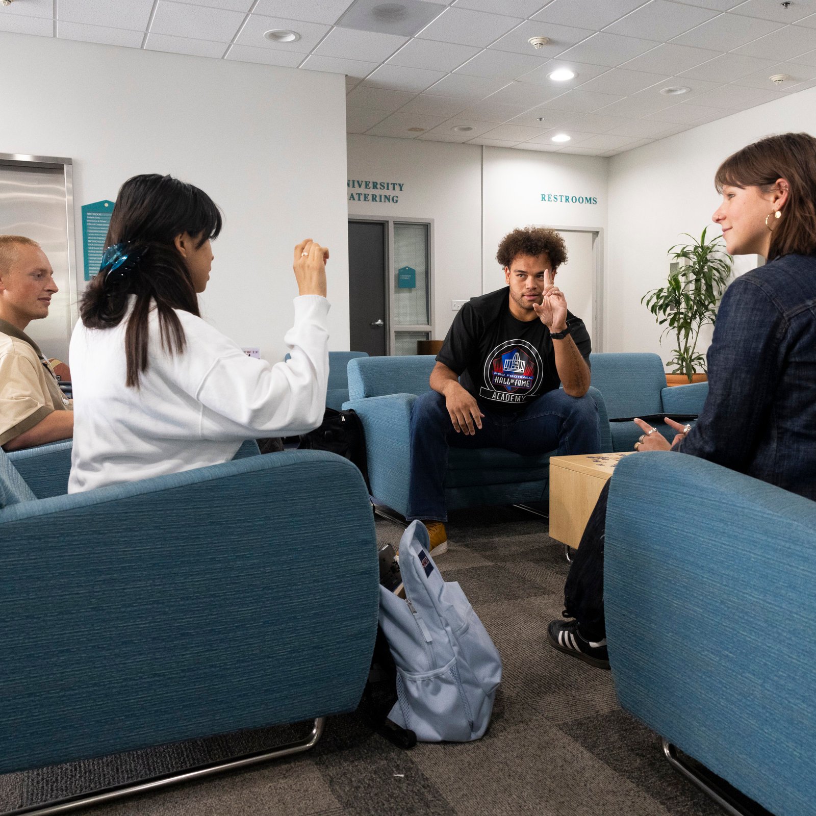 a group of people sitting in chairs