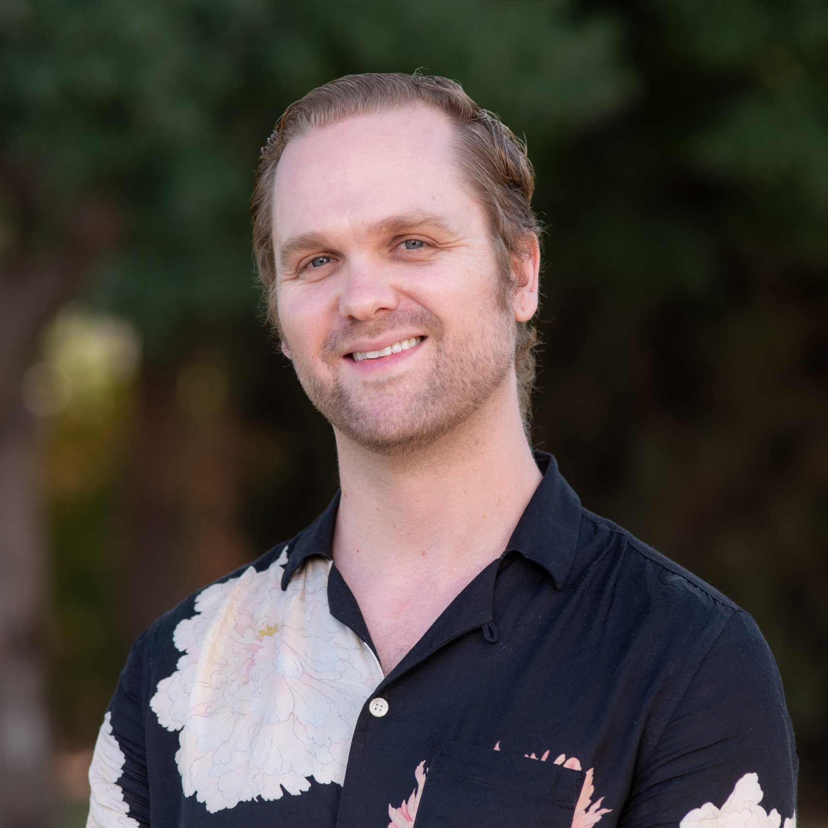 a man smiling for a picture