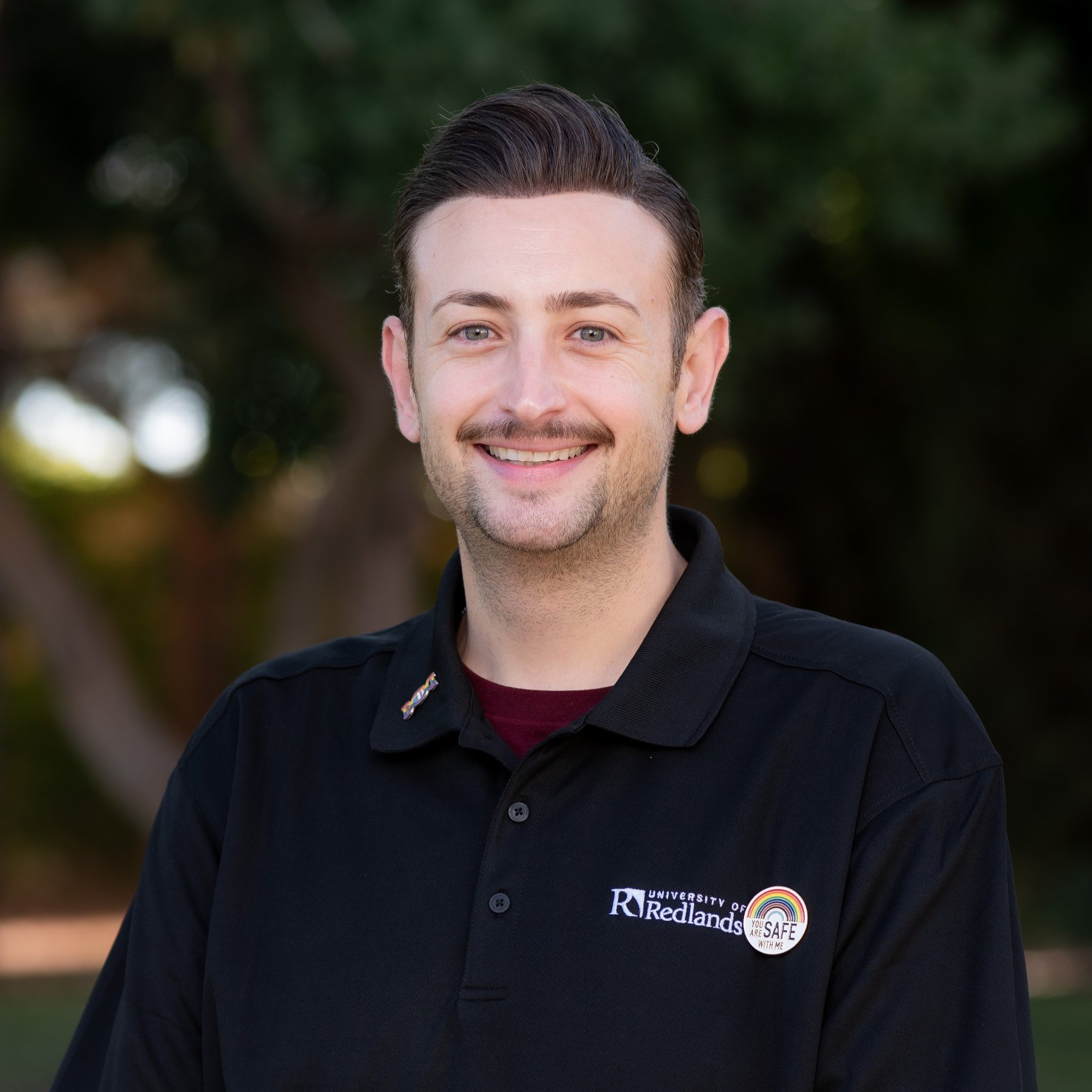 a man smiling for a picture
