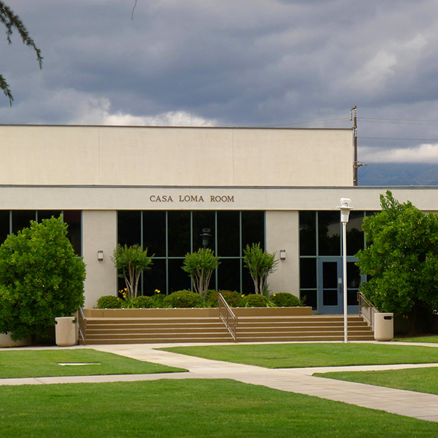 a building with a lawn and trees