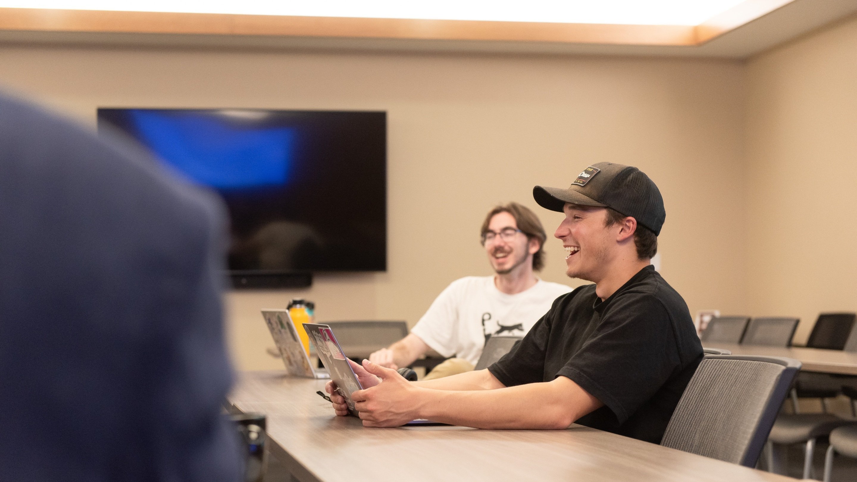 a group of men sitting at a table