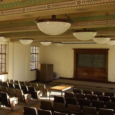 a room with chairs and a podium