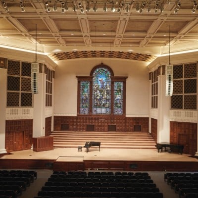 a large room with a stained glass window