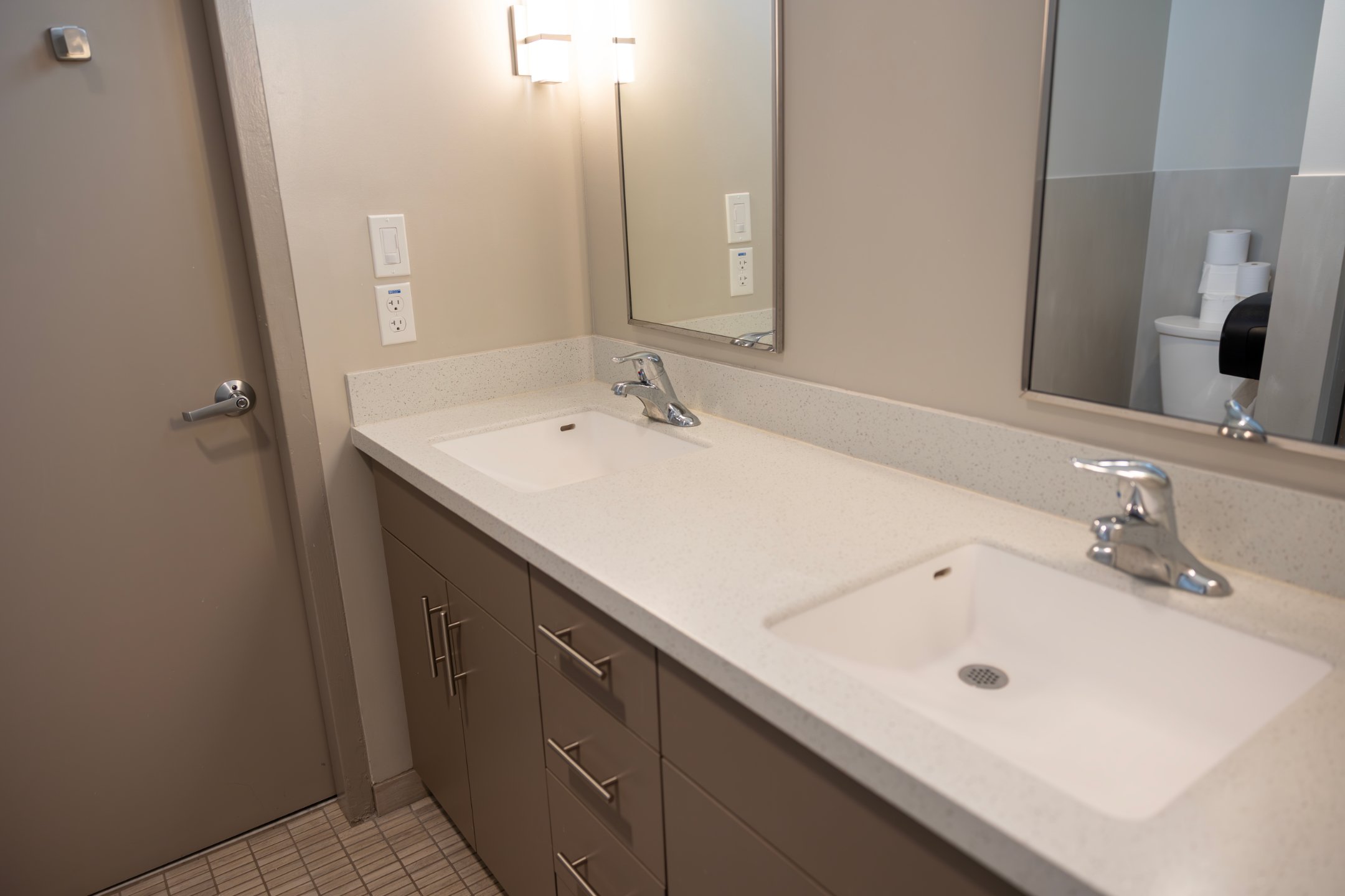 a bathroom with a sink and mirror
