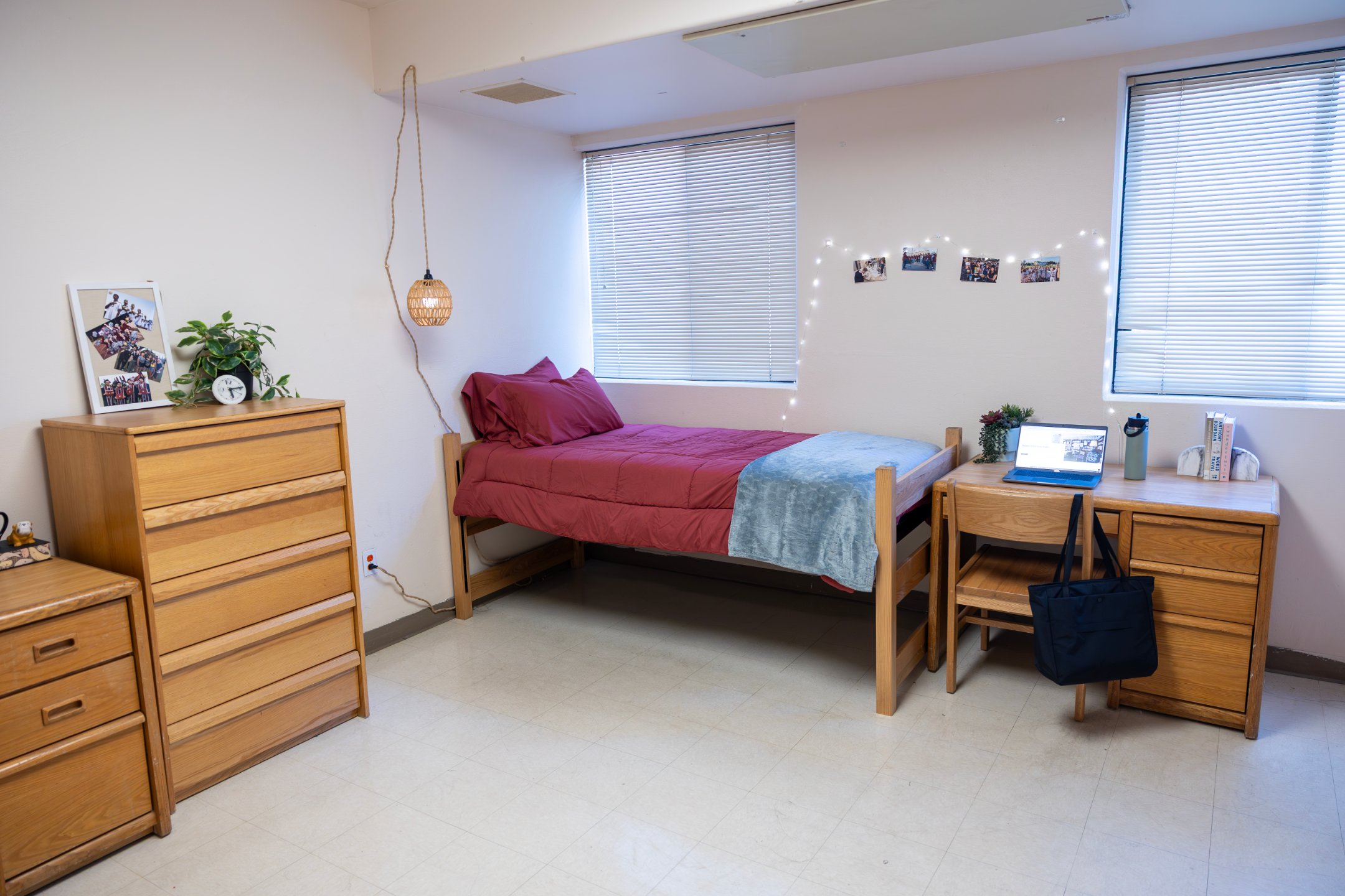 a bedroom with a bed and a desk
