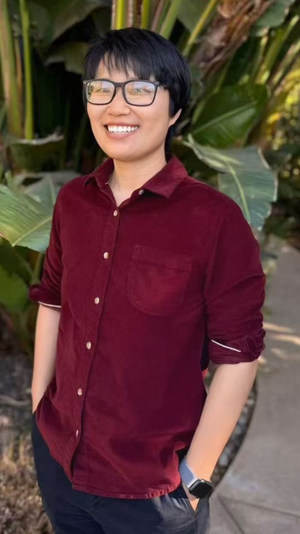 a woman smiling with sunglasses