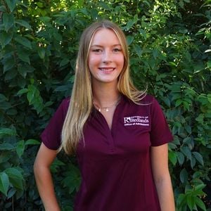 a woman in a maroon shirt