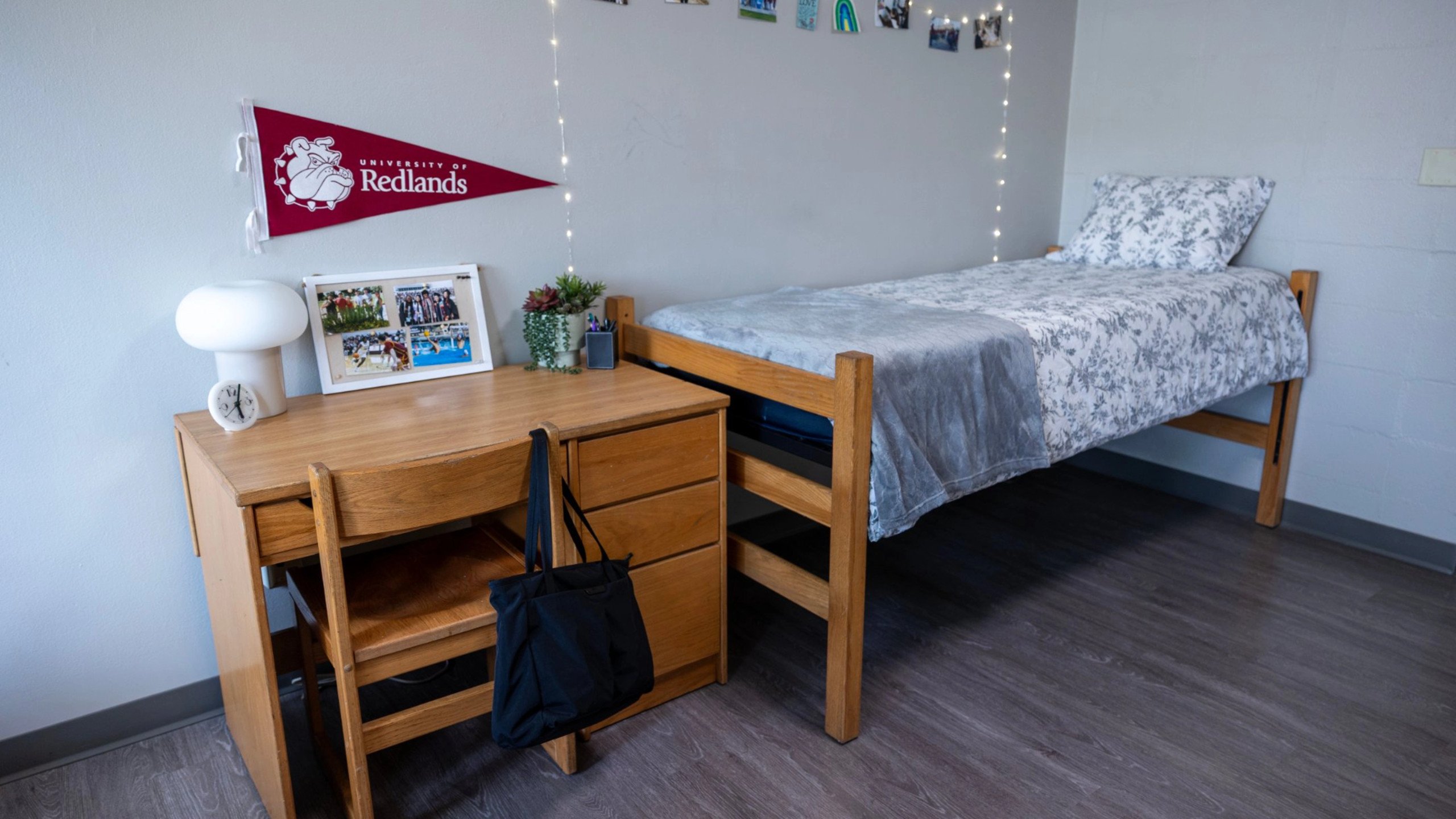 a bed and desk in a room