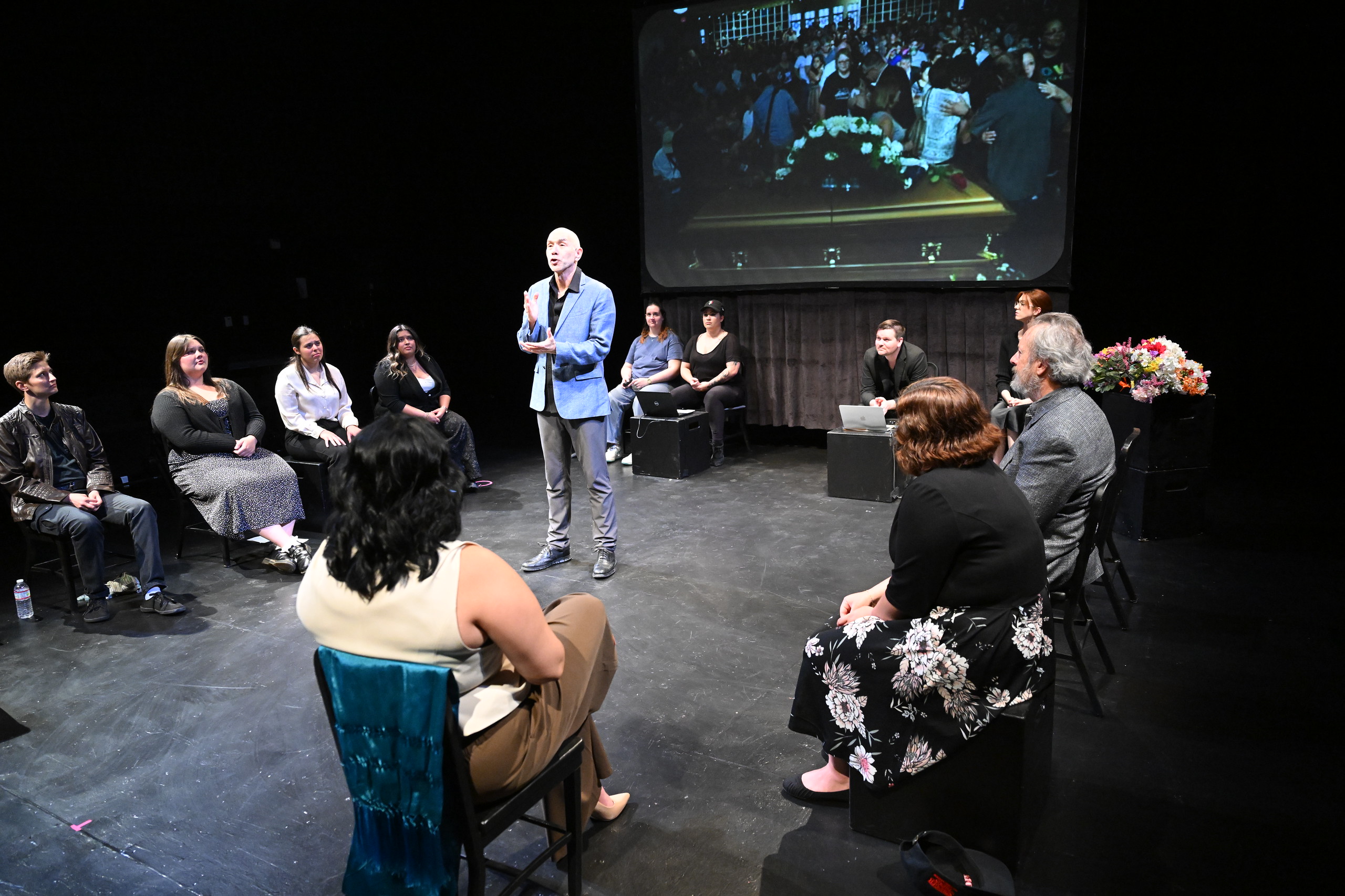 a man standing in front of a group of people