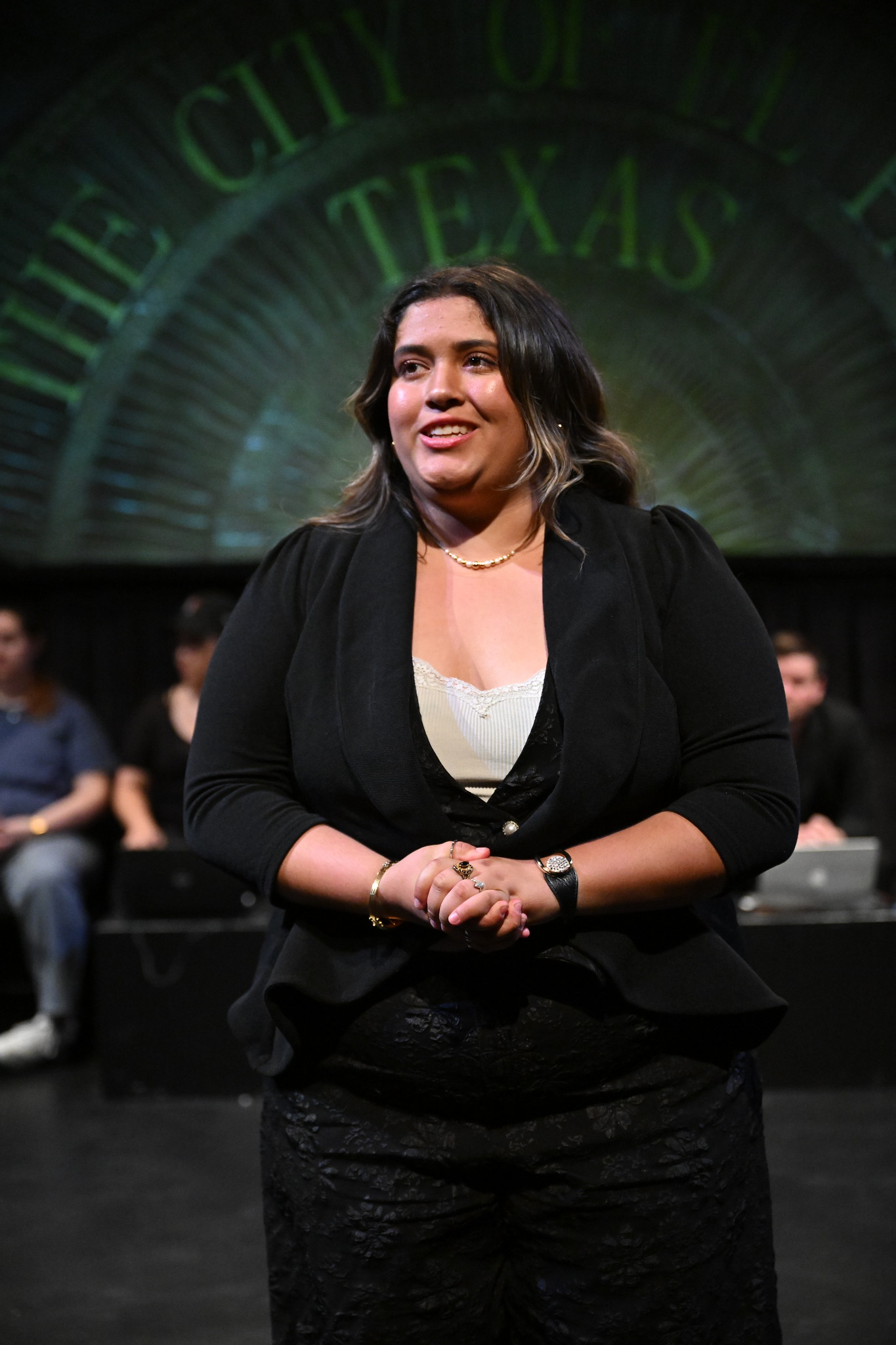 a woman in a black suit