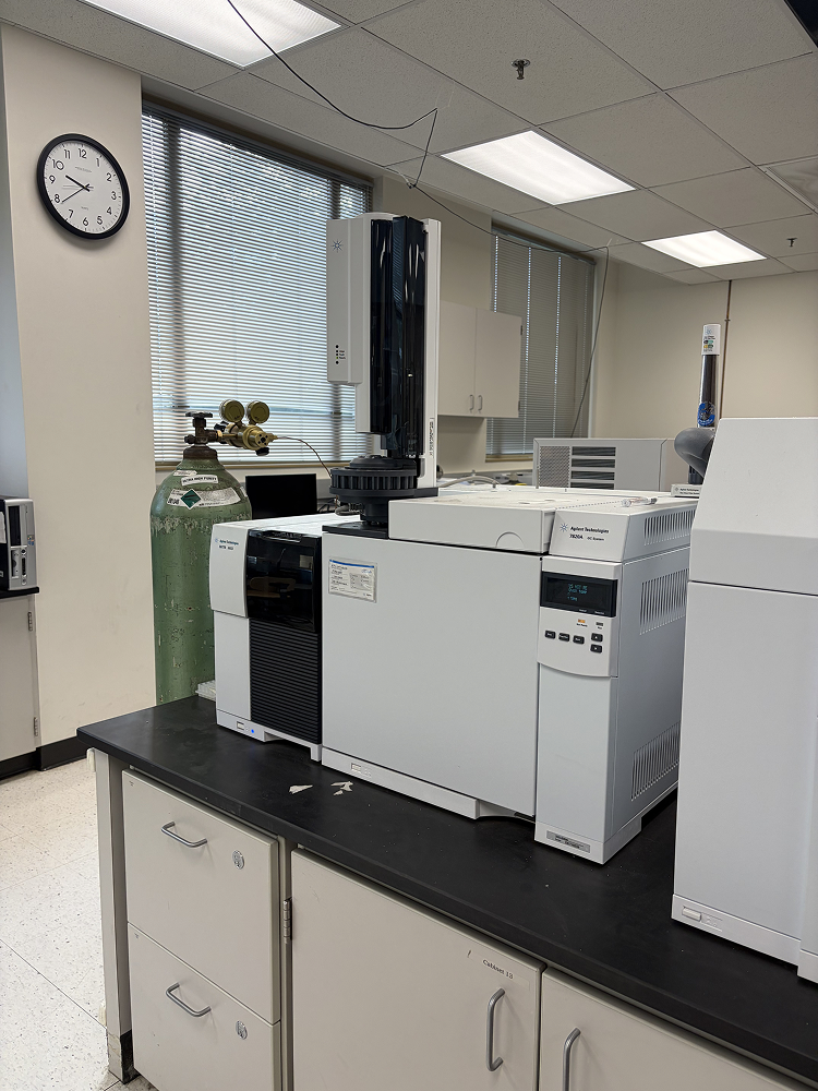 a large white machine on a black counter