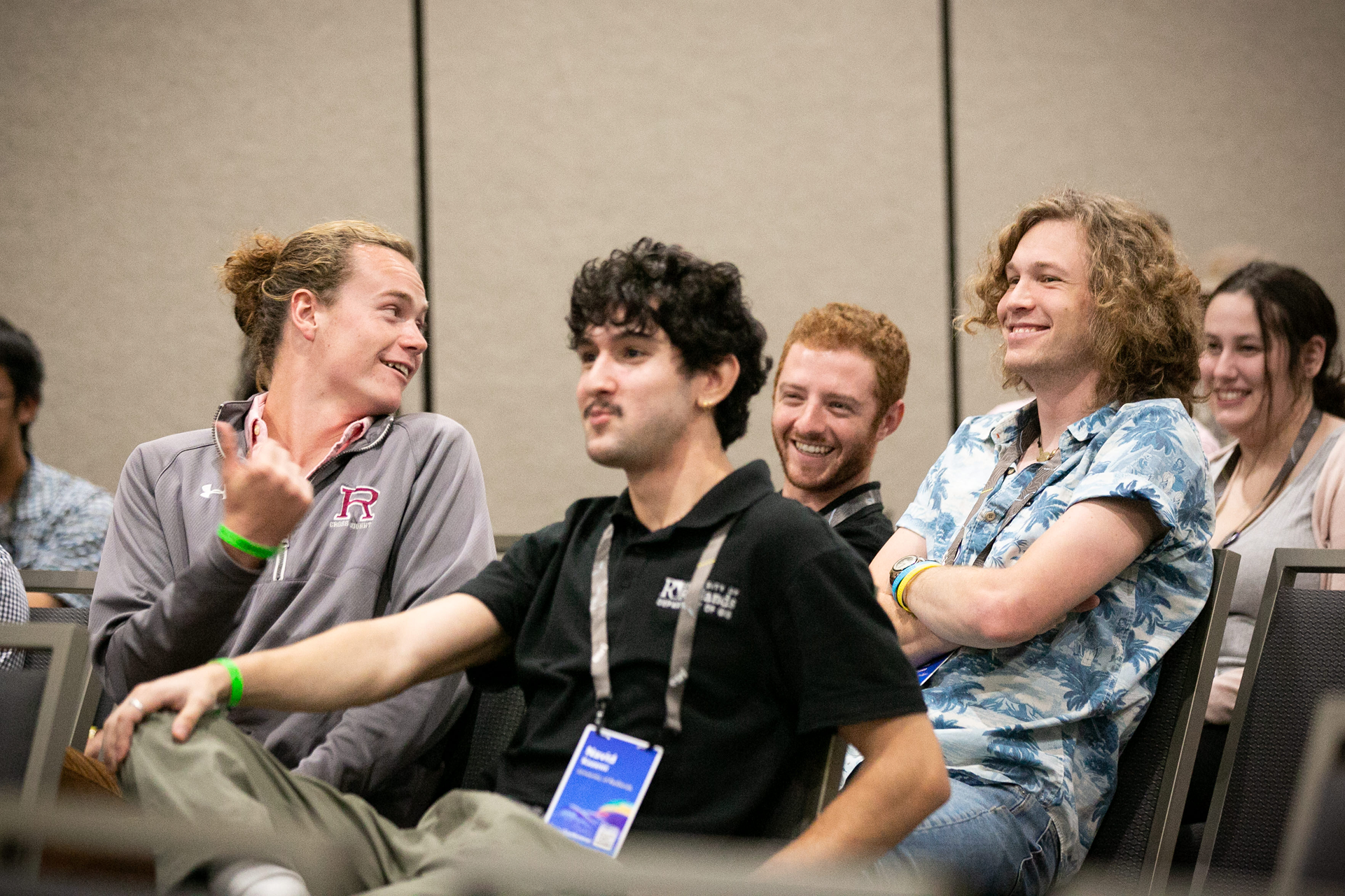 a group of men sitting in a room
